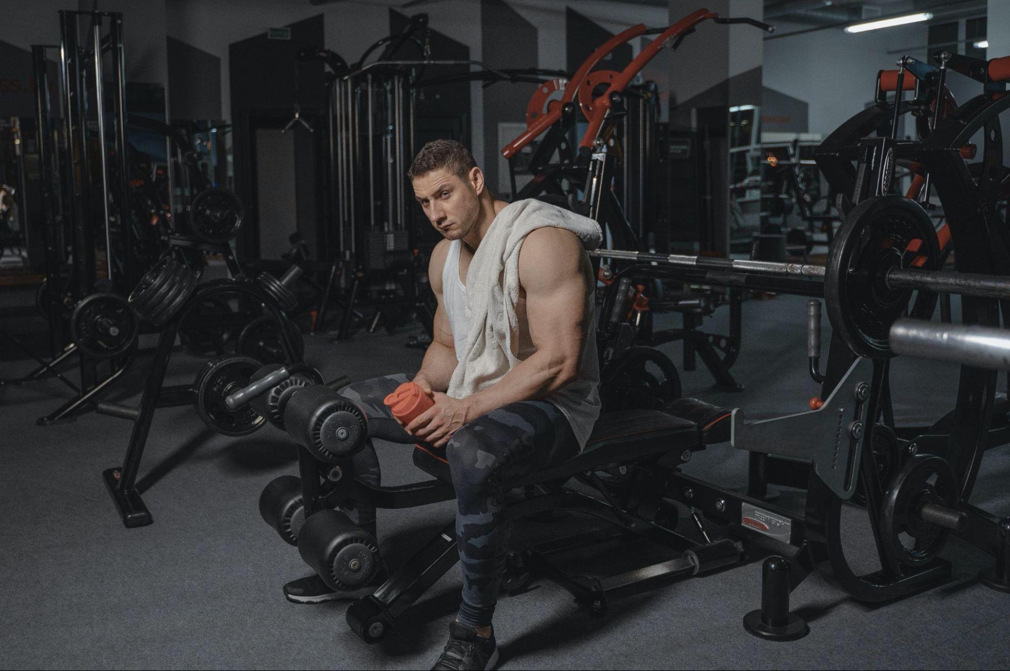 Man resting between sets at the gym