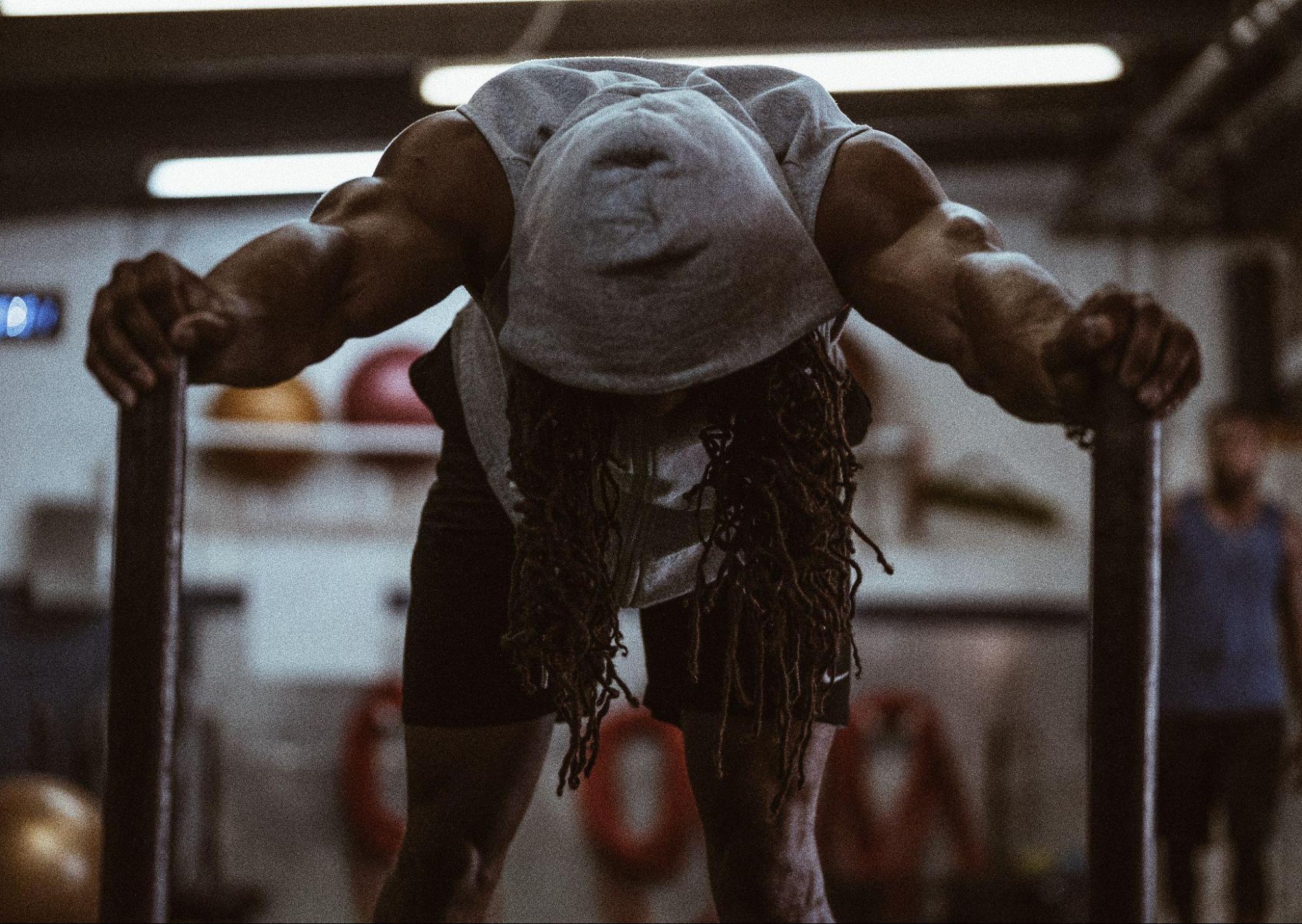 person pushing through at the gym