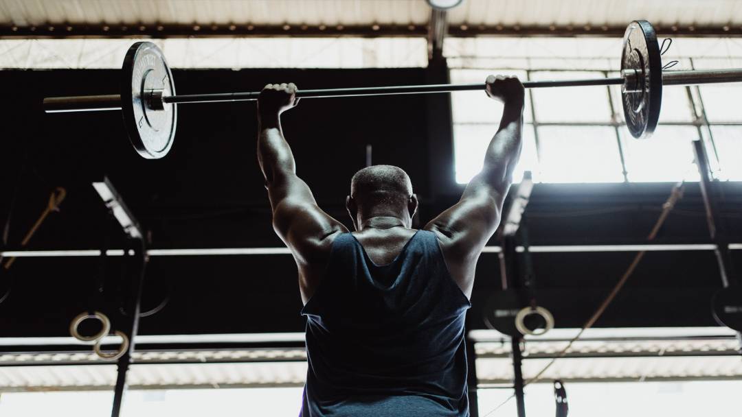 person lifting barbell