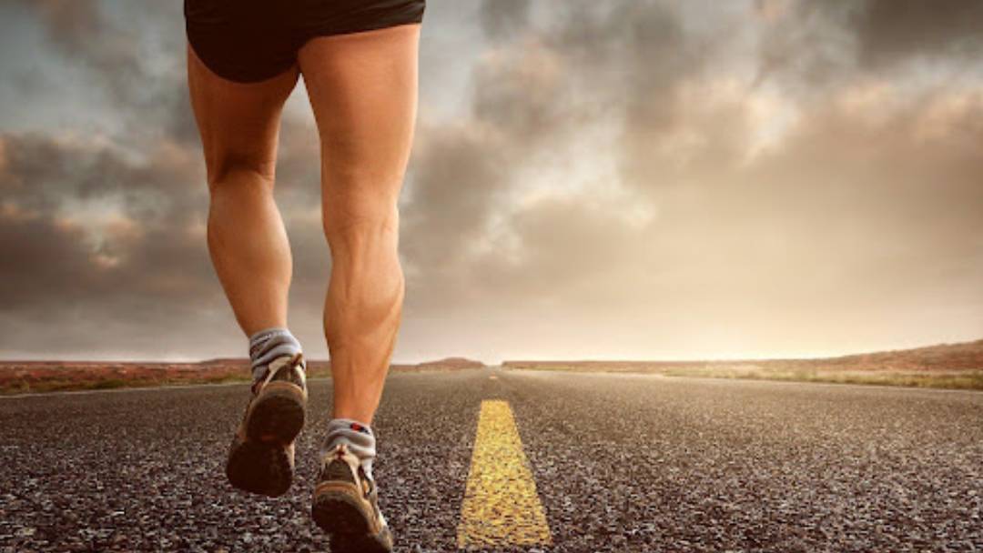  A person running on a road.