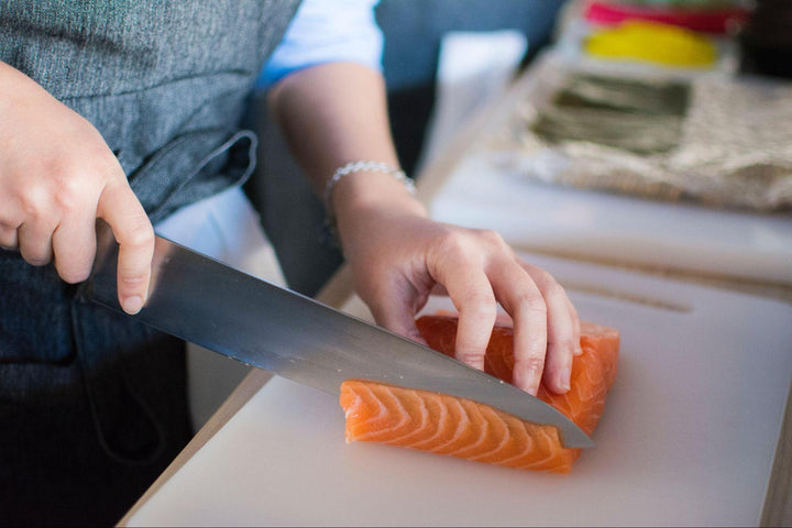a man cutting salmon