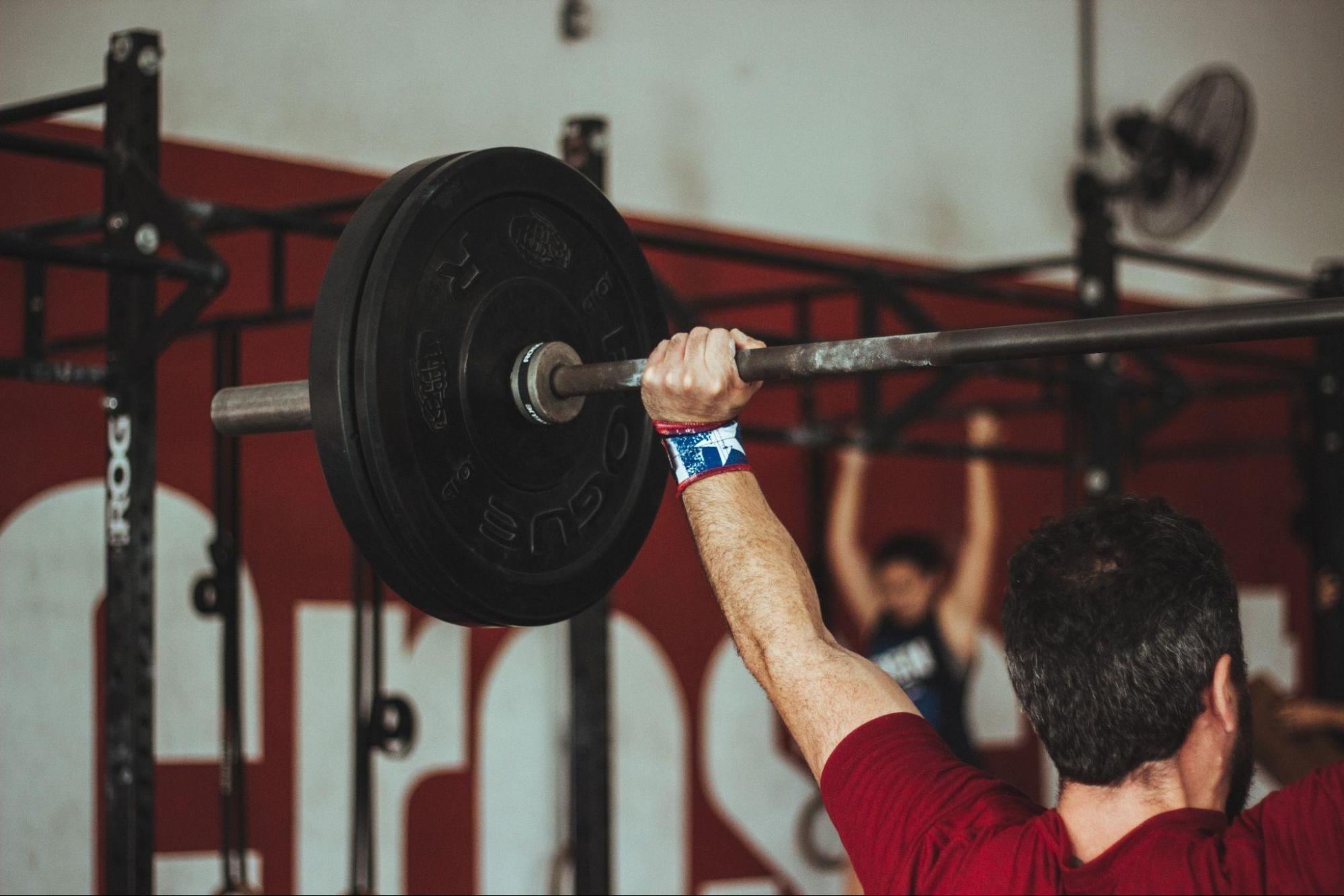 person finishing a snatch exercise