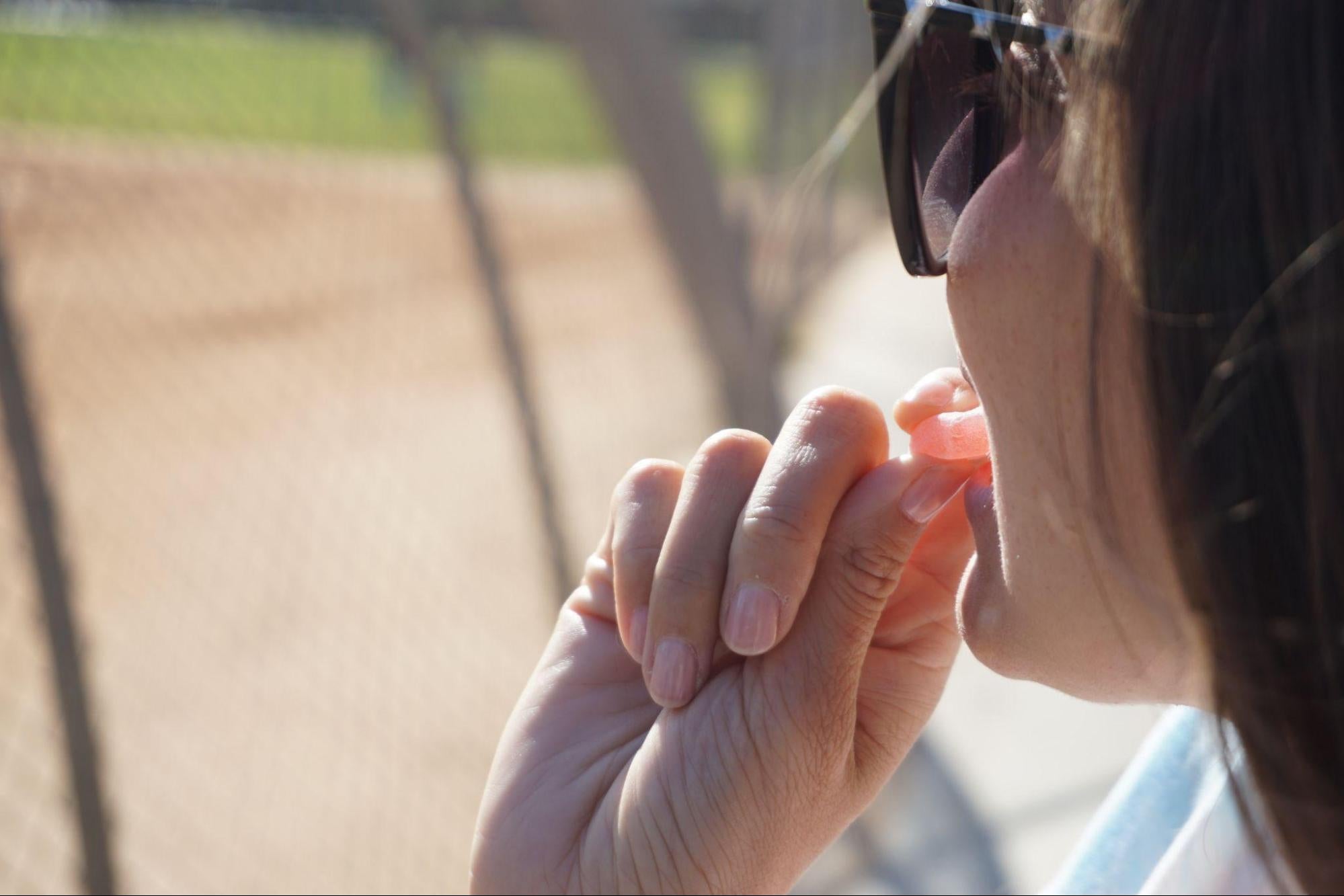 person eating an energy chew