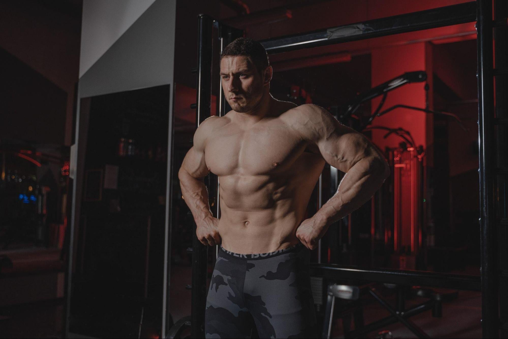  a man flexing his muscles without a shirt