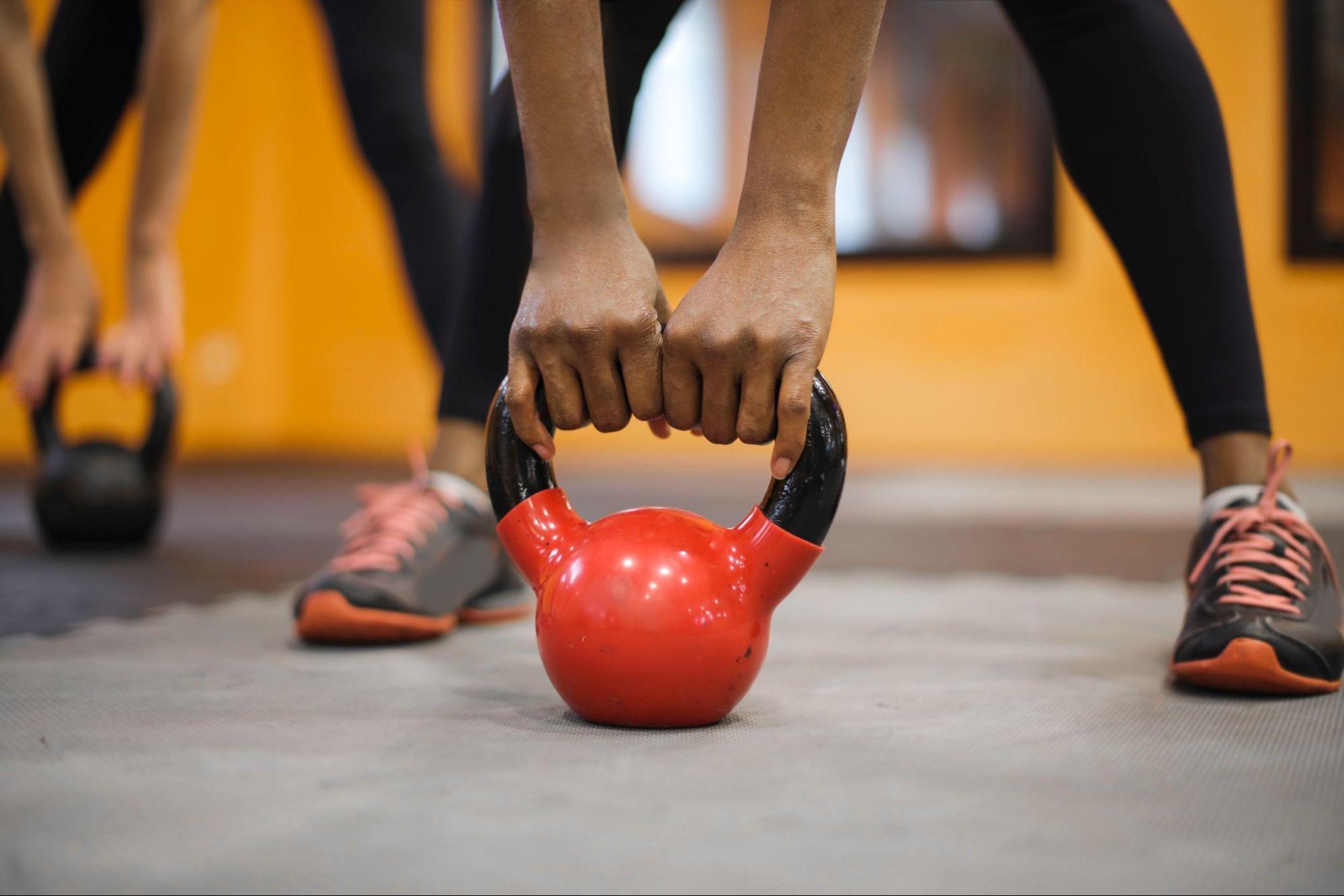  a person holding a kettlebell
