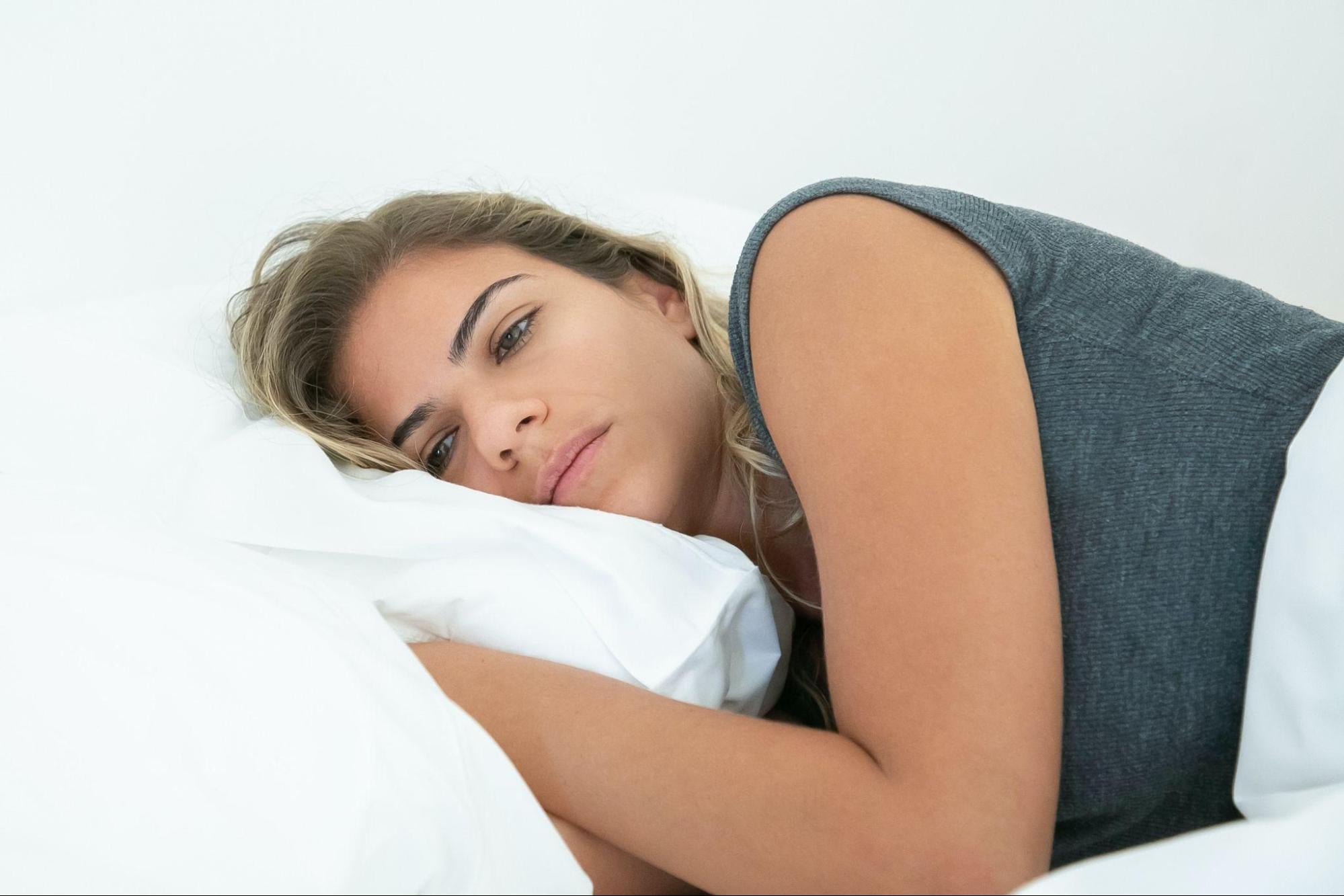 a woman lying in bed