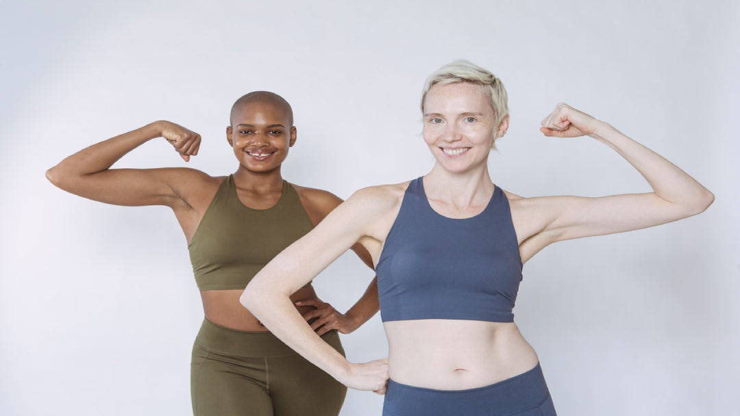 fit women flexing arms