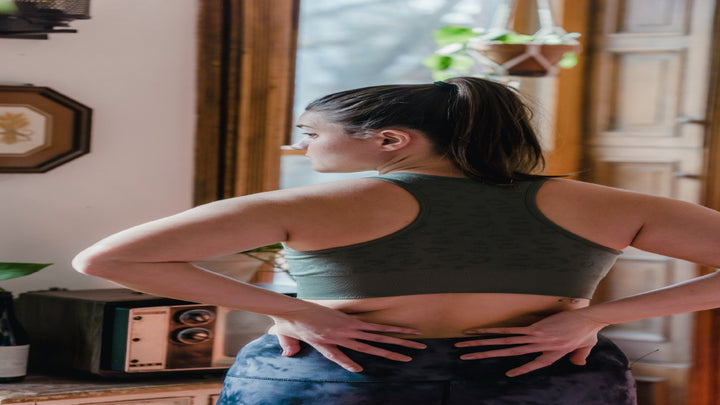 woman holding lower back fat